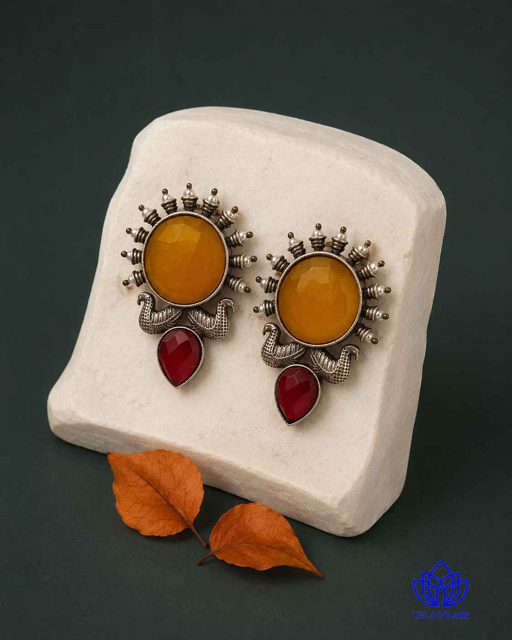 Silver-plated finish covers the surface of this sunburst earring.