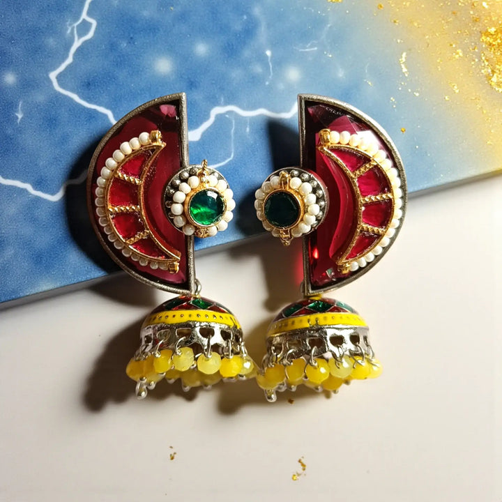 Brass construction supports the fusion kundan design of this earring.
