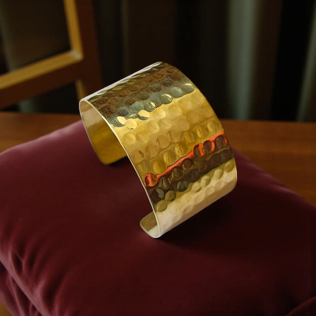 Tarnish-free wide hammered brass cuff bracelet for women featuring smooth textured finish and elegant open design

