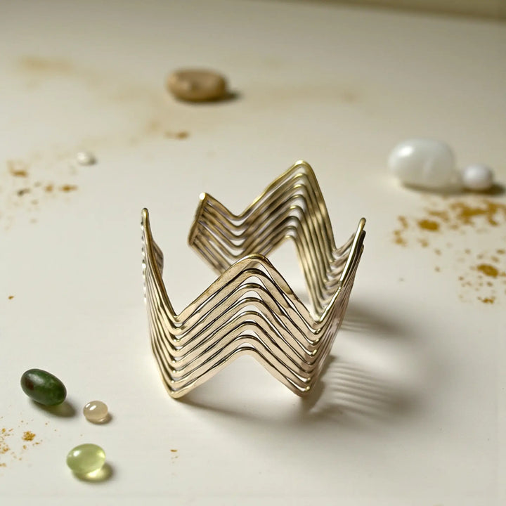Tarnish-free zigzag sculptural brass cuff bracelet for women featuring artistic curved design and golden finish
