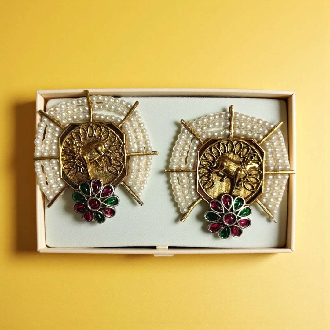 Elegant Ishmita dual tone silver plated stud earrings in red & green by Tela Naari – perfect for festive or bridal wear
