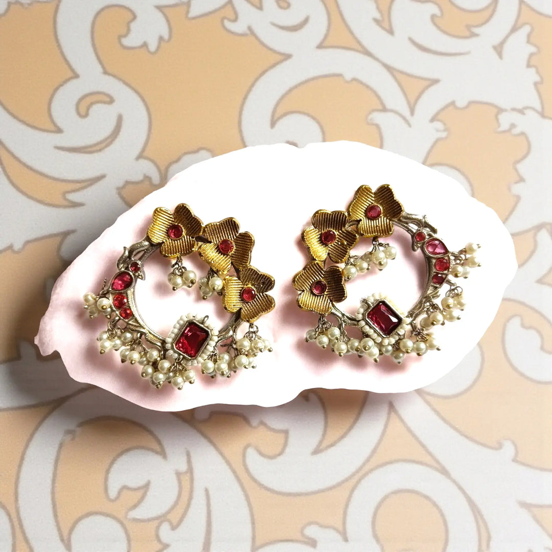 Elegant Ishwika dual tone silver plated stud earrings in red by Tela Naari – perfect for festive / bridal looks
