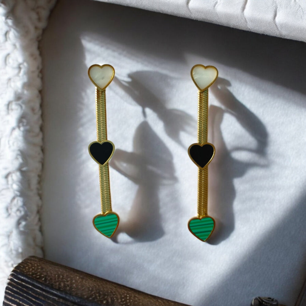 “Elegant triple heart drop earrings by Tela Naari”