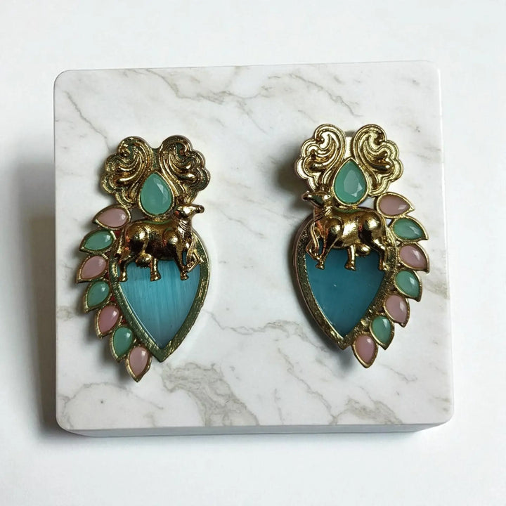 Bhuana dual tone stud earrings in sky blue — serene picks for office parties, daytime events, and soft ethnic looks.
