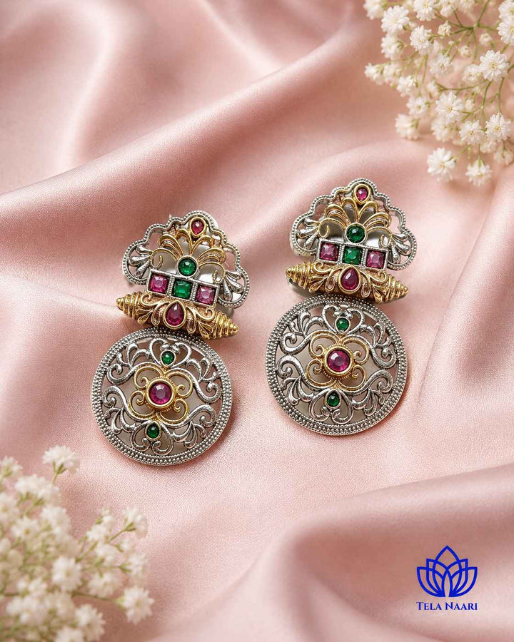 Round silhouette showcases the temple-inspired filigree detailing clearly.