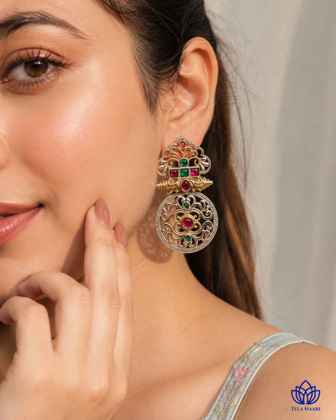 This bestselling Tela Naari earring pairs oxidised silver with dual-tone style.