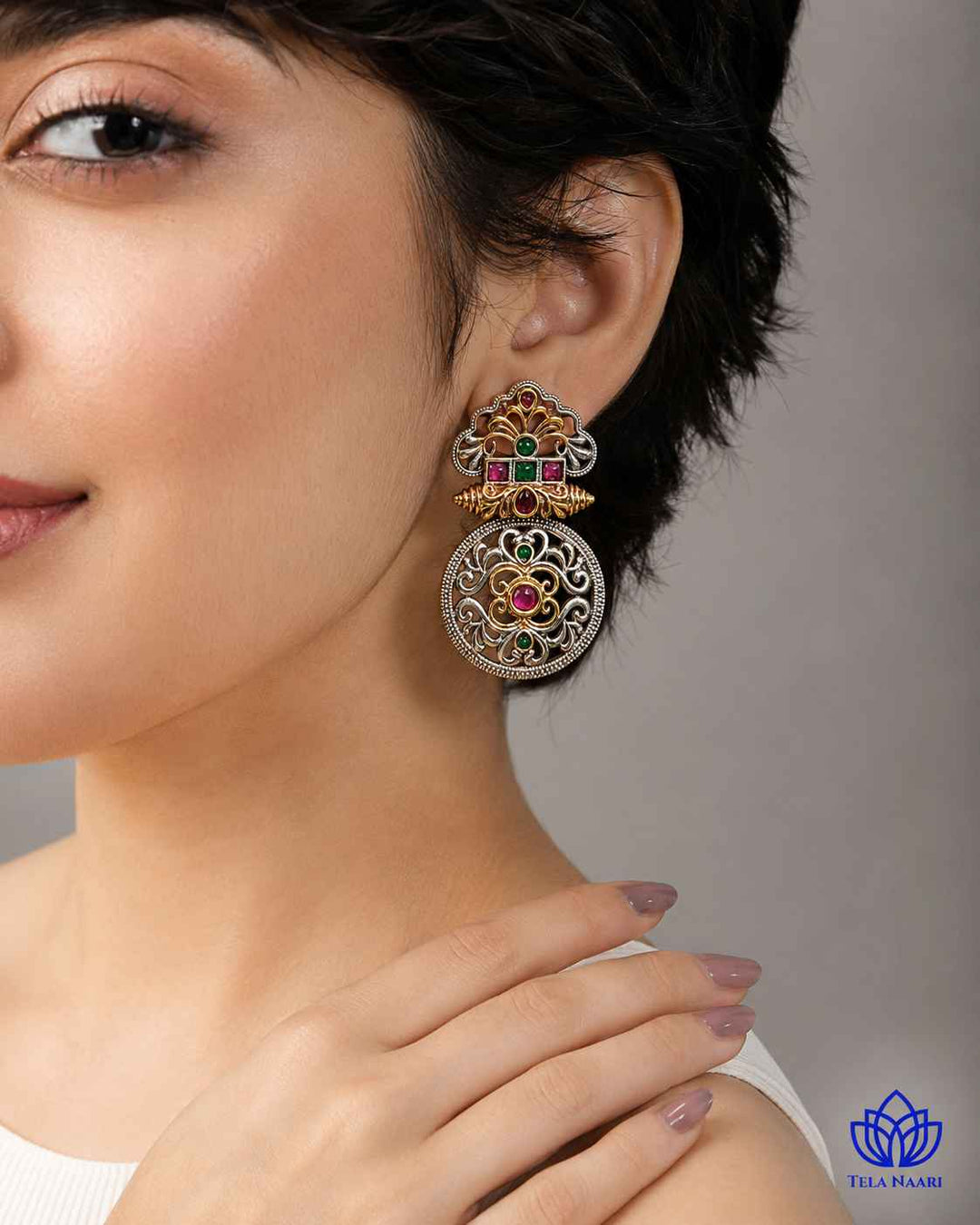 Push back closure keeps this temple-inspired earring secure comfortably.