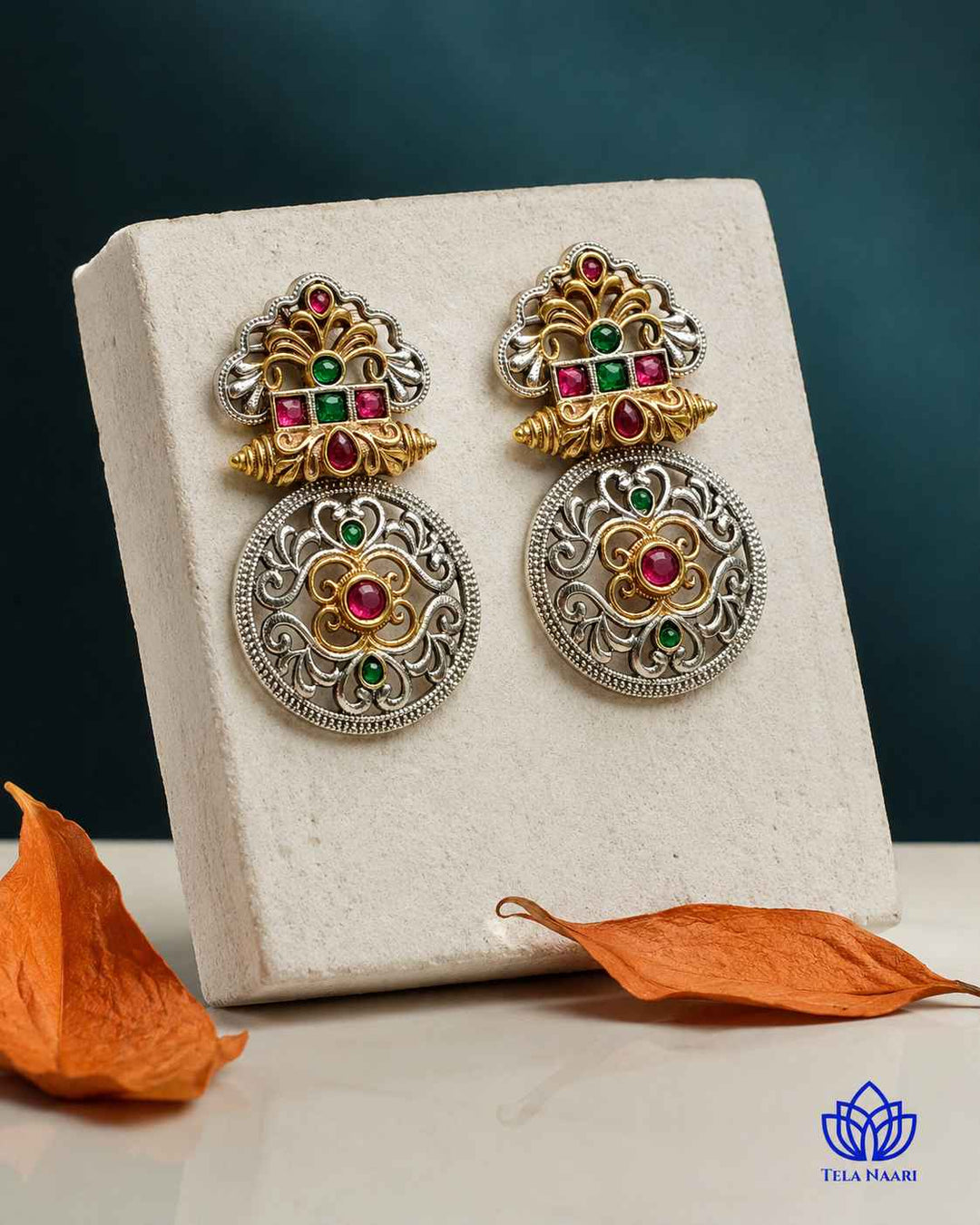 Ornate filigree work defines this temple-inspired dual-tone earring.