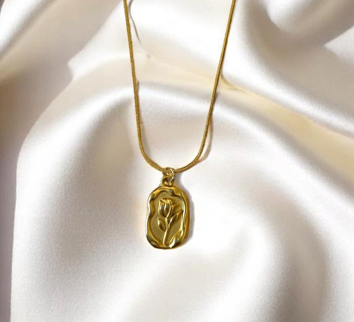 Detailed close-up of tulip design gold-plated anti-tarnish pendant, Tela Naari