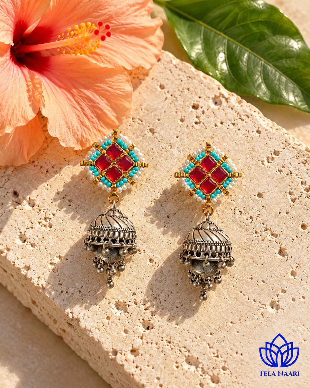 Two-inch drop defines the silhouette of this jhumka.