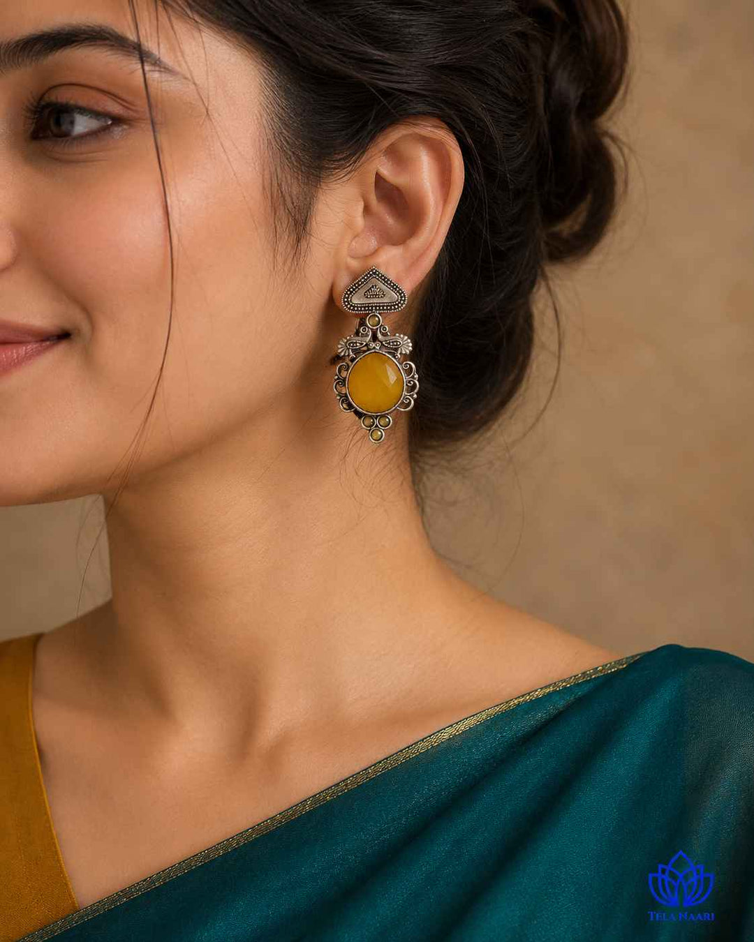 Silver oxidised finish gives this earring a textured antique surface.