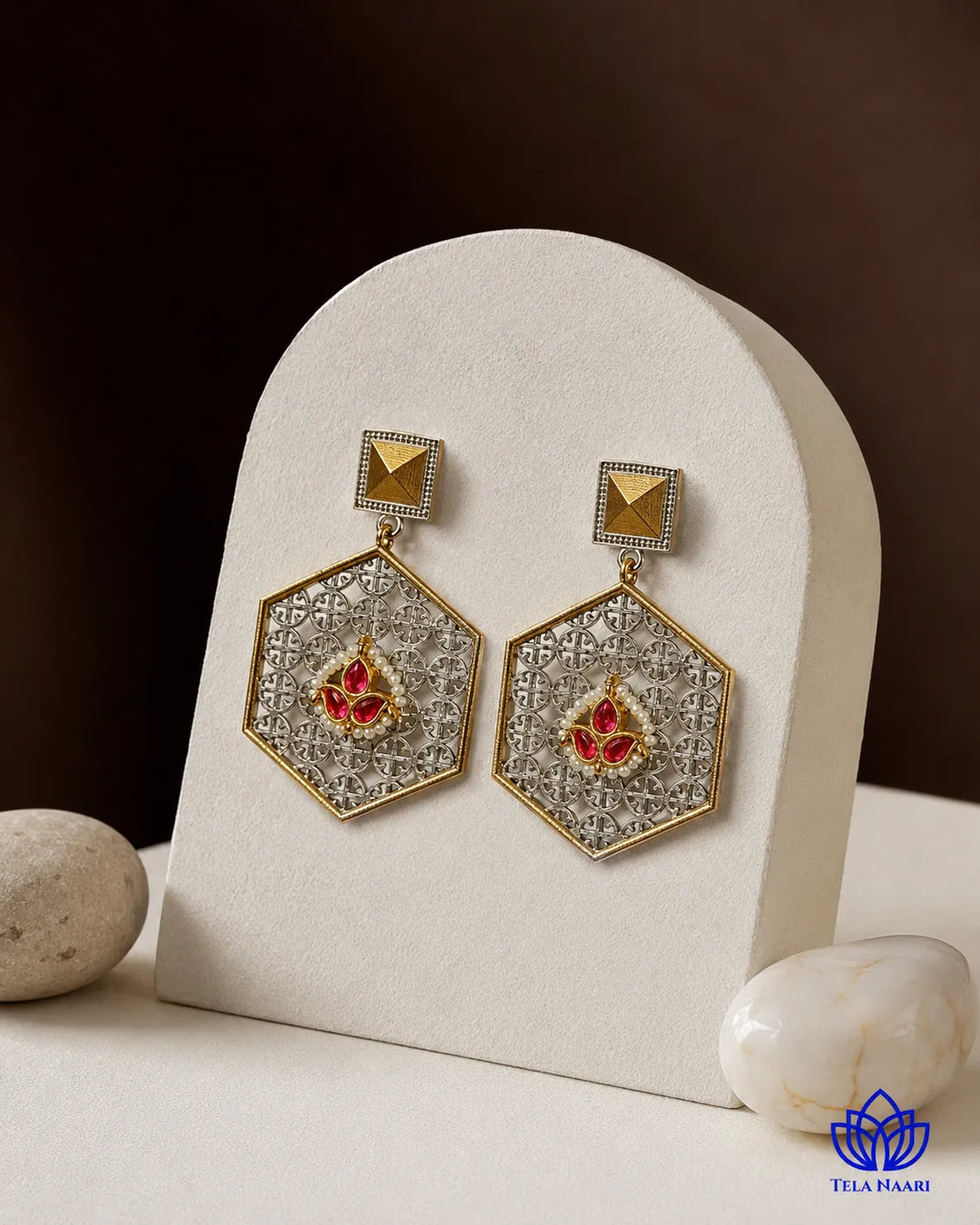 Handcrafted detailing defines the hexagon silhouette of this earring.