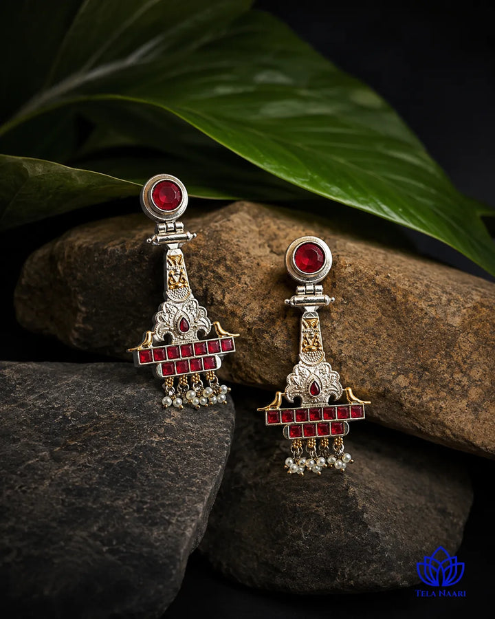 Brass construction forms the structure of this temple earring design.