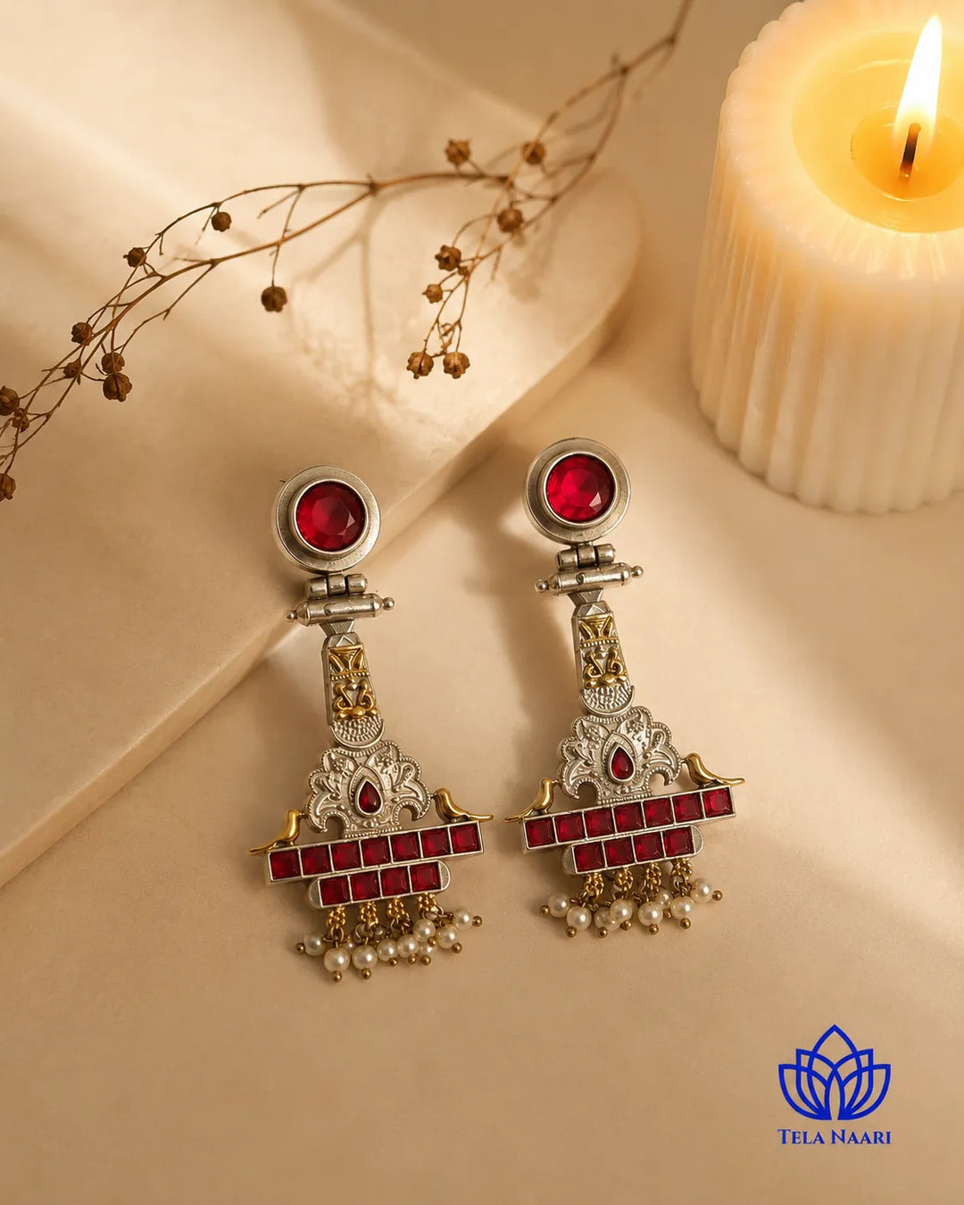 Festive detailing highlights the temple motif of this earring.