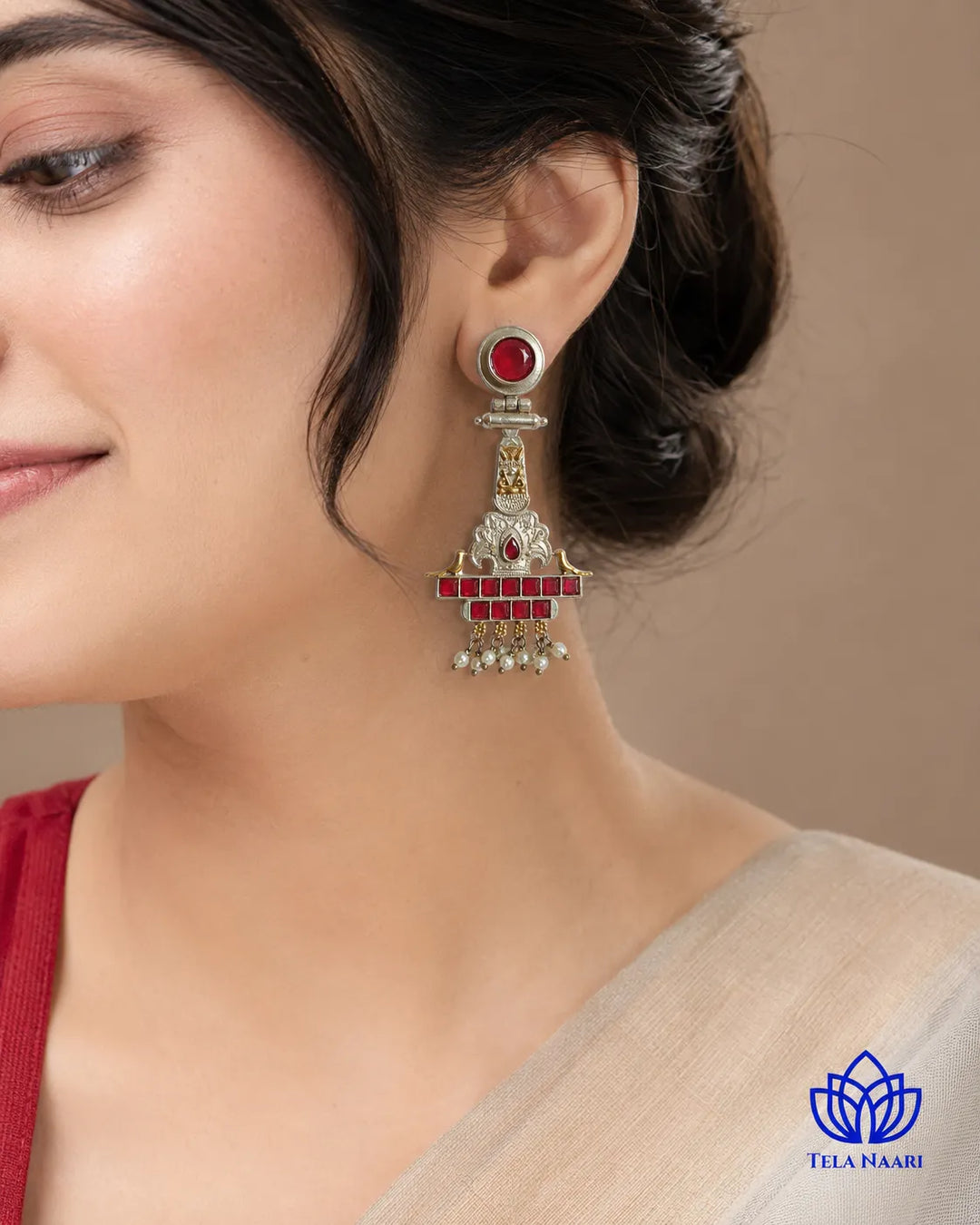 Oxidised finish covers half of this dual-tone temple earring.