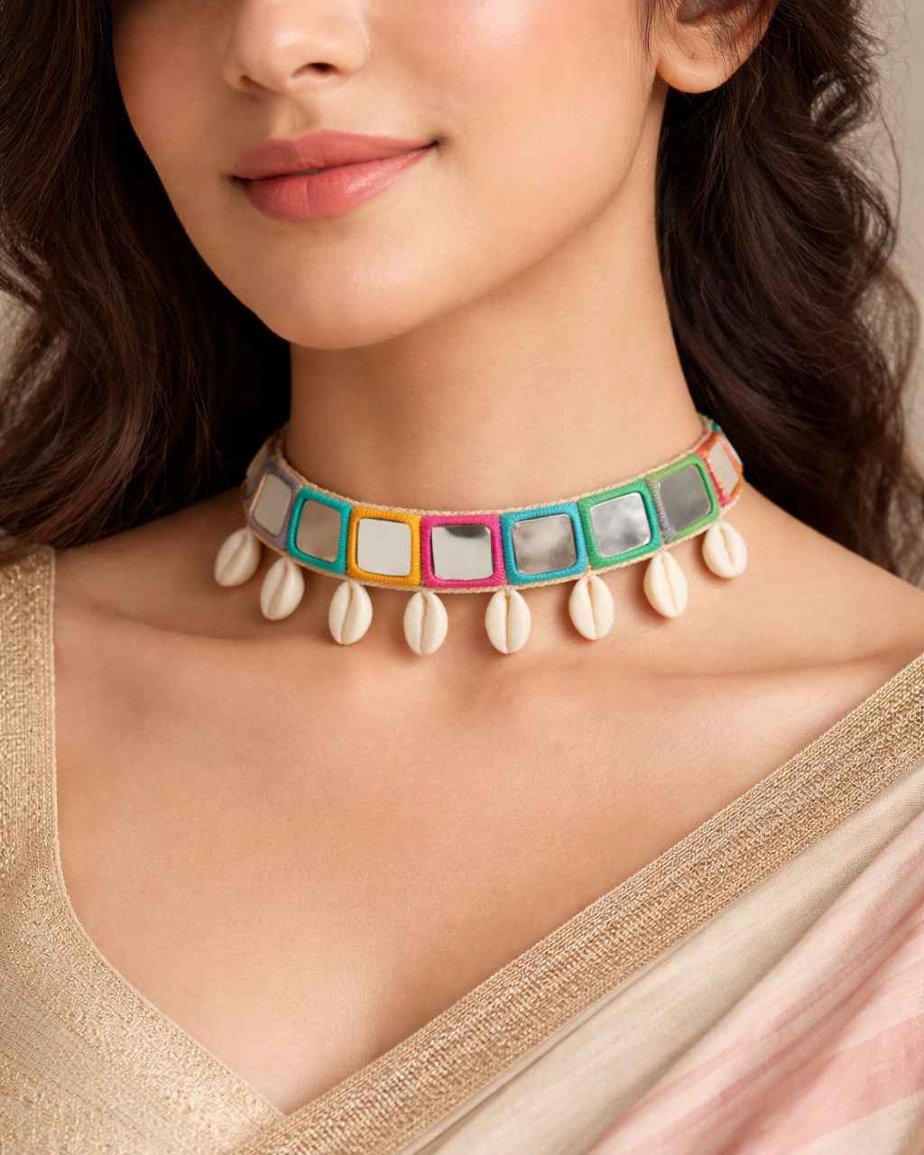 Gleaming mirror accents shape the silhouette of this choker.