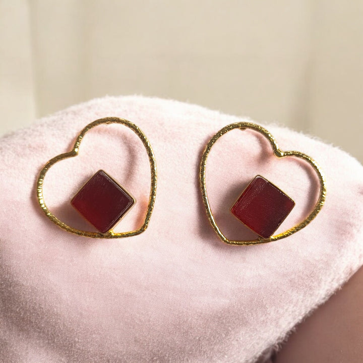 Brass construction supports the lightweight heart-shaped design.