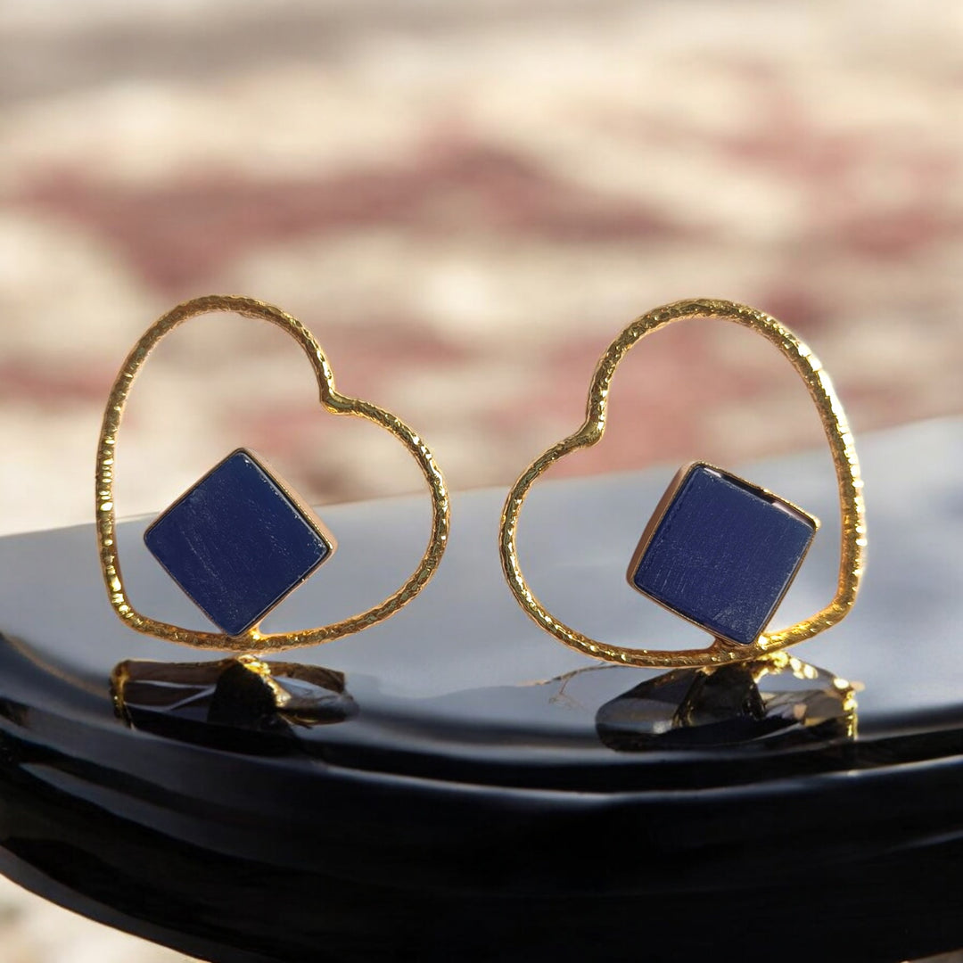Romantic heart-shaped drop defines the silhouette of this earring.