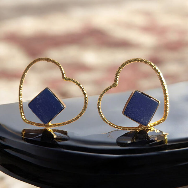 Romantic heart-shaped drop defines the silhouette of this earring.
