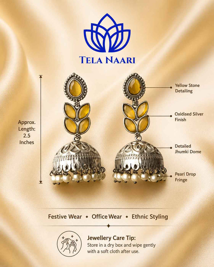 Artificial stone detailing decorates the surface of this jhumka earring.