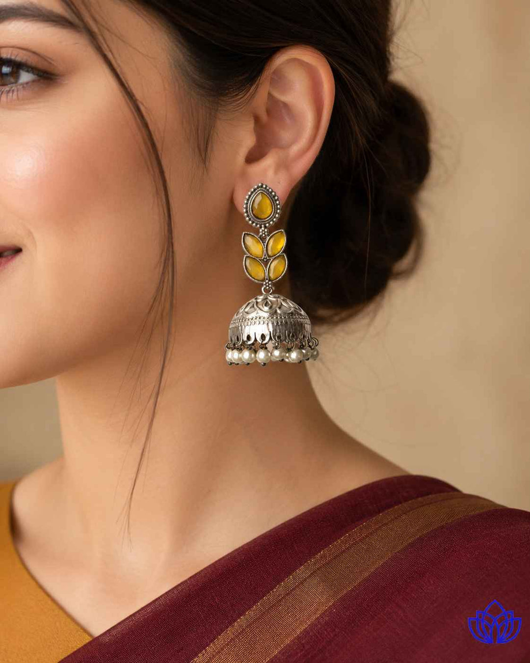Silver-plated finish covers the brass base of this teardrop earring.