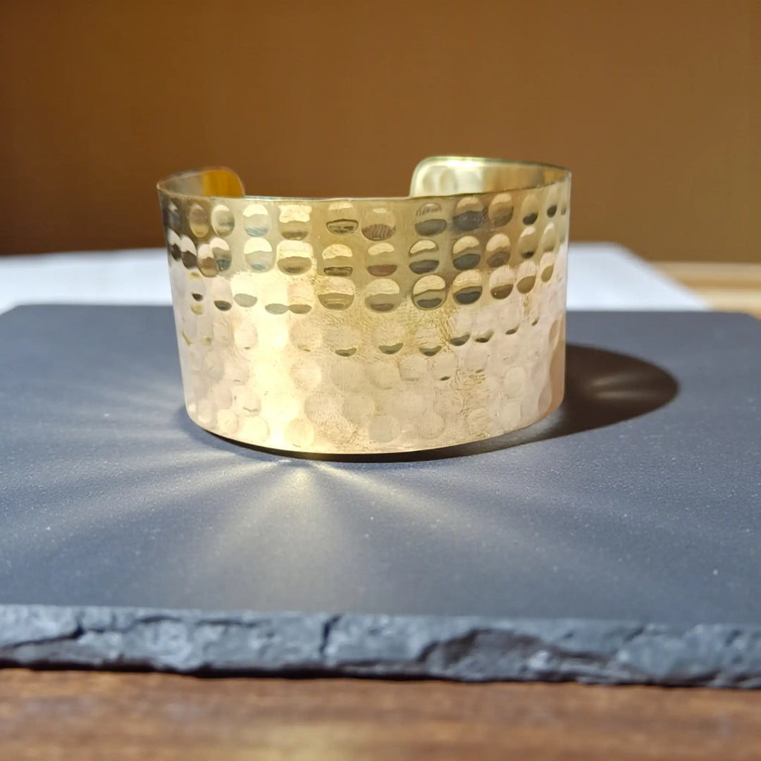 Wide hammered anti-tarnish hand bracelet for women with modern minimal brass texture and polished sheen
