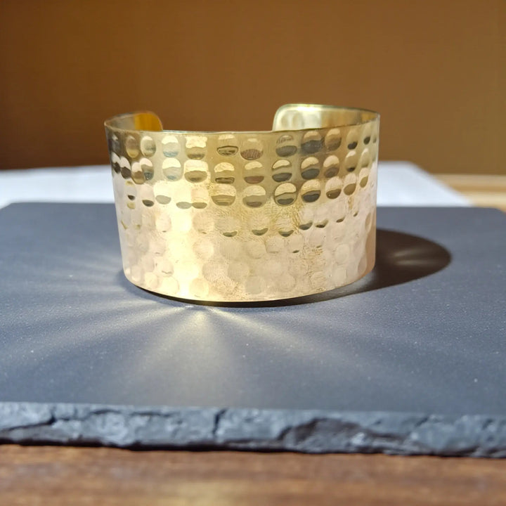 Wide hammered anti-tarnish hand bracelet for women with modern minimal brass texture and polished sheen
