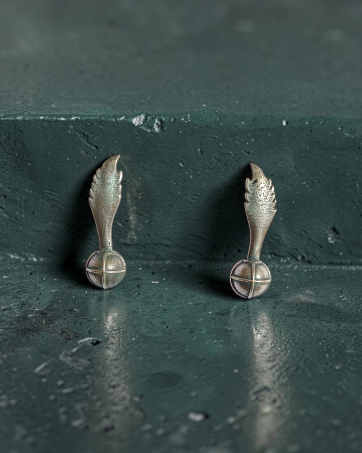 Darkened oxidised finish gives this wing stud its artisanal charm.