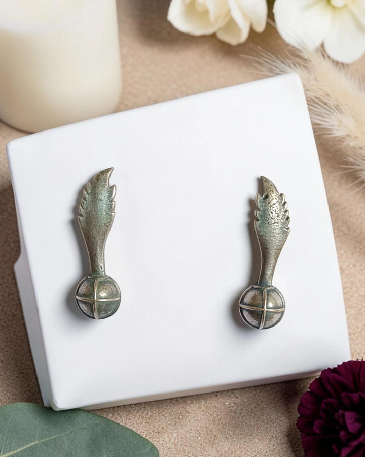 Delicate wing-shaped silhouette defines this oxidised silver stud earring.