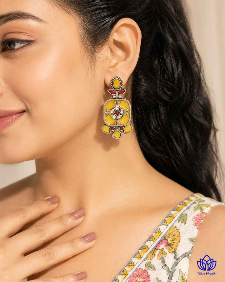 Bright yellow hues give this dangler earring a cheerful daily accent.
