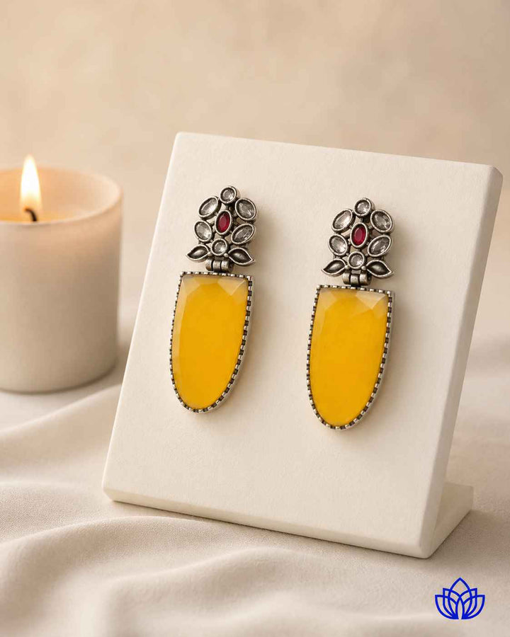 Silver plating catches the light across this earring&
