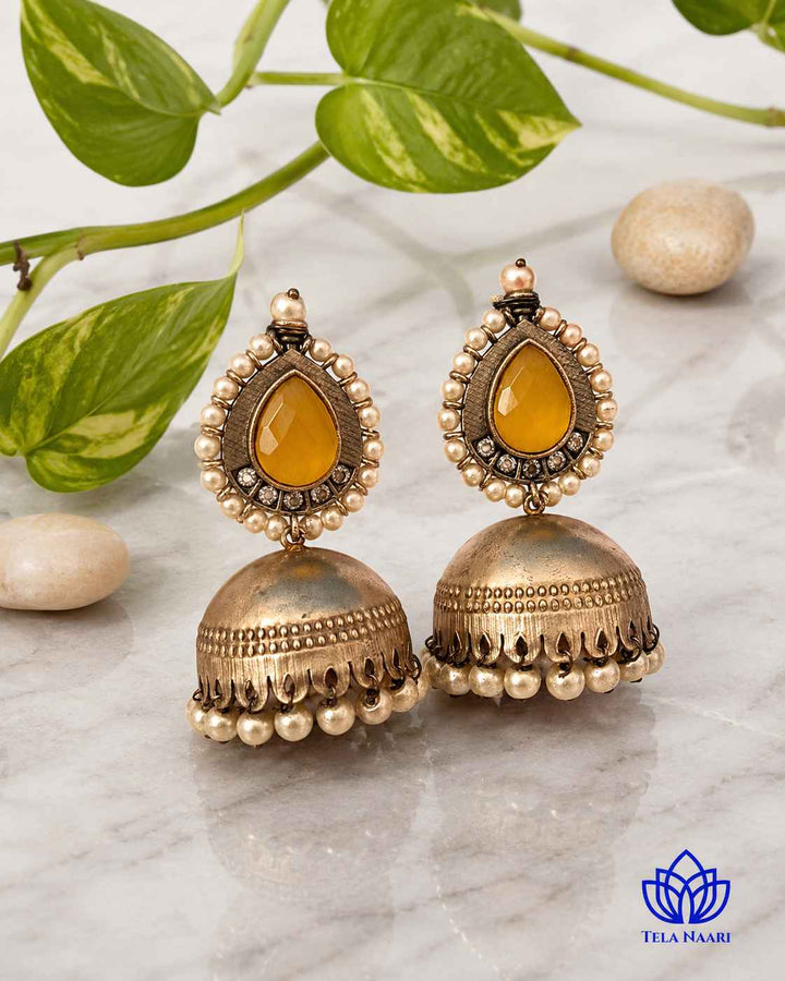 Post and back closure keeps this jhumka earring secure throughout wear.