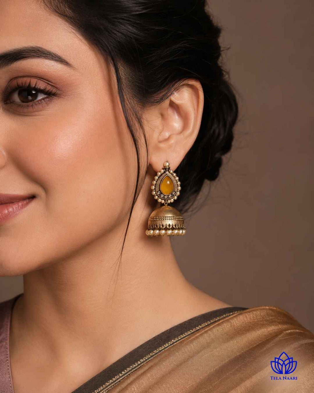Silver-plated finish gives this jhumka a soft, warm shine.