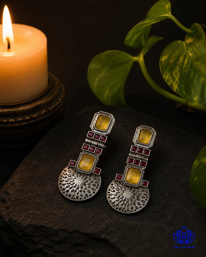 Handcrafted detailing shapes the bold design of this earring.