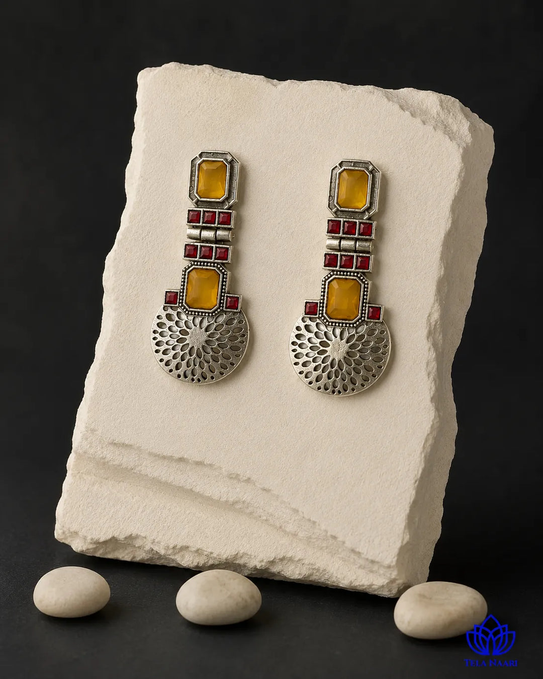 Oxidised silver finish covers the surface of this statement earring.